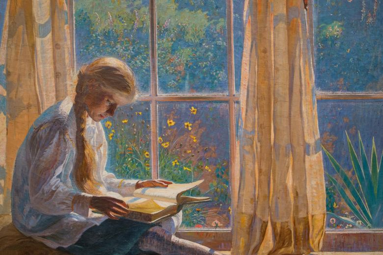 Girl reading by the window